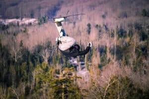 skier hitting jumps at otsego resort